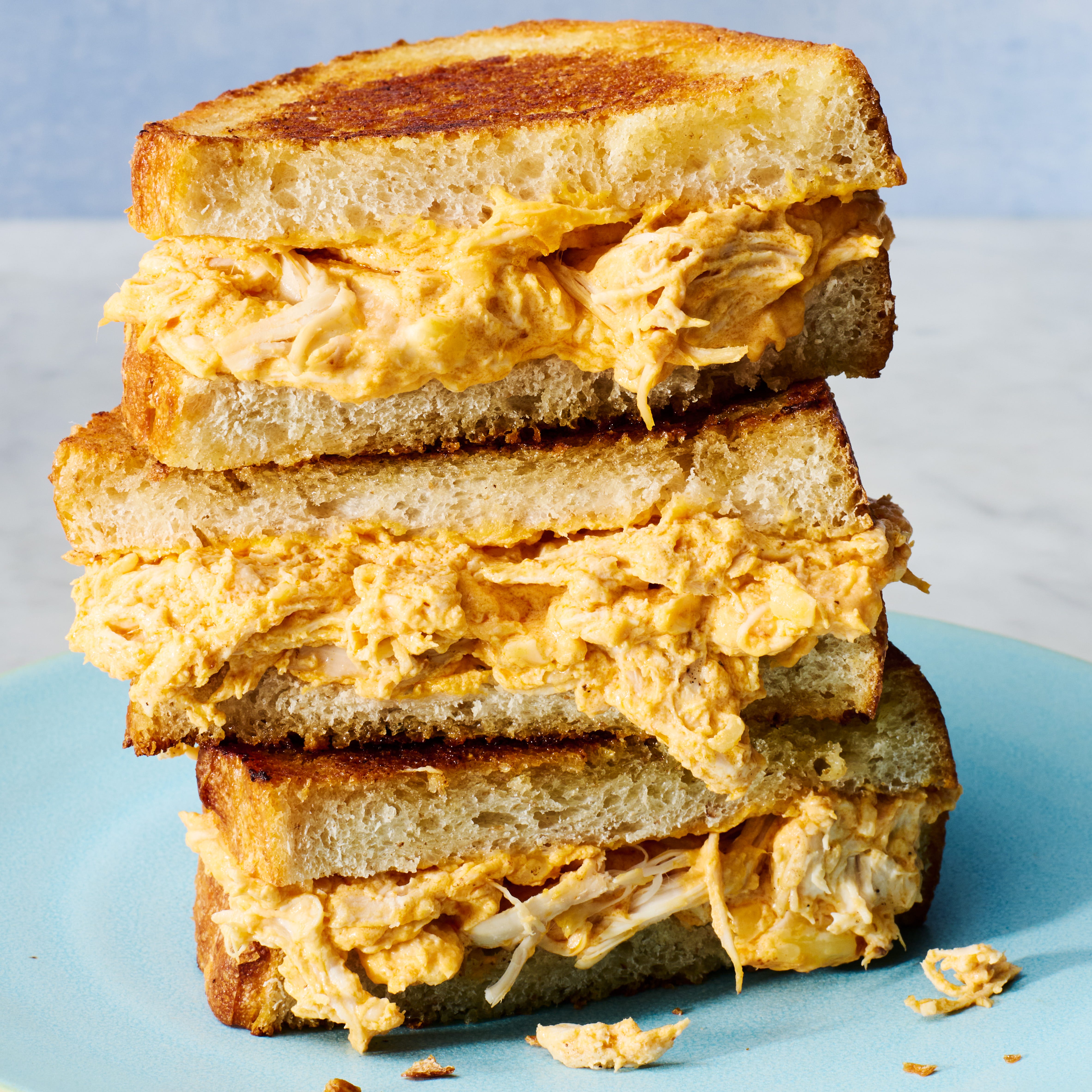 buffalo chicken mixture in a grilled cheese