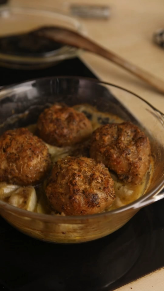 Vegan roasted chicken over leeks with crispy potatoes