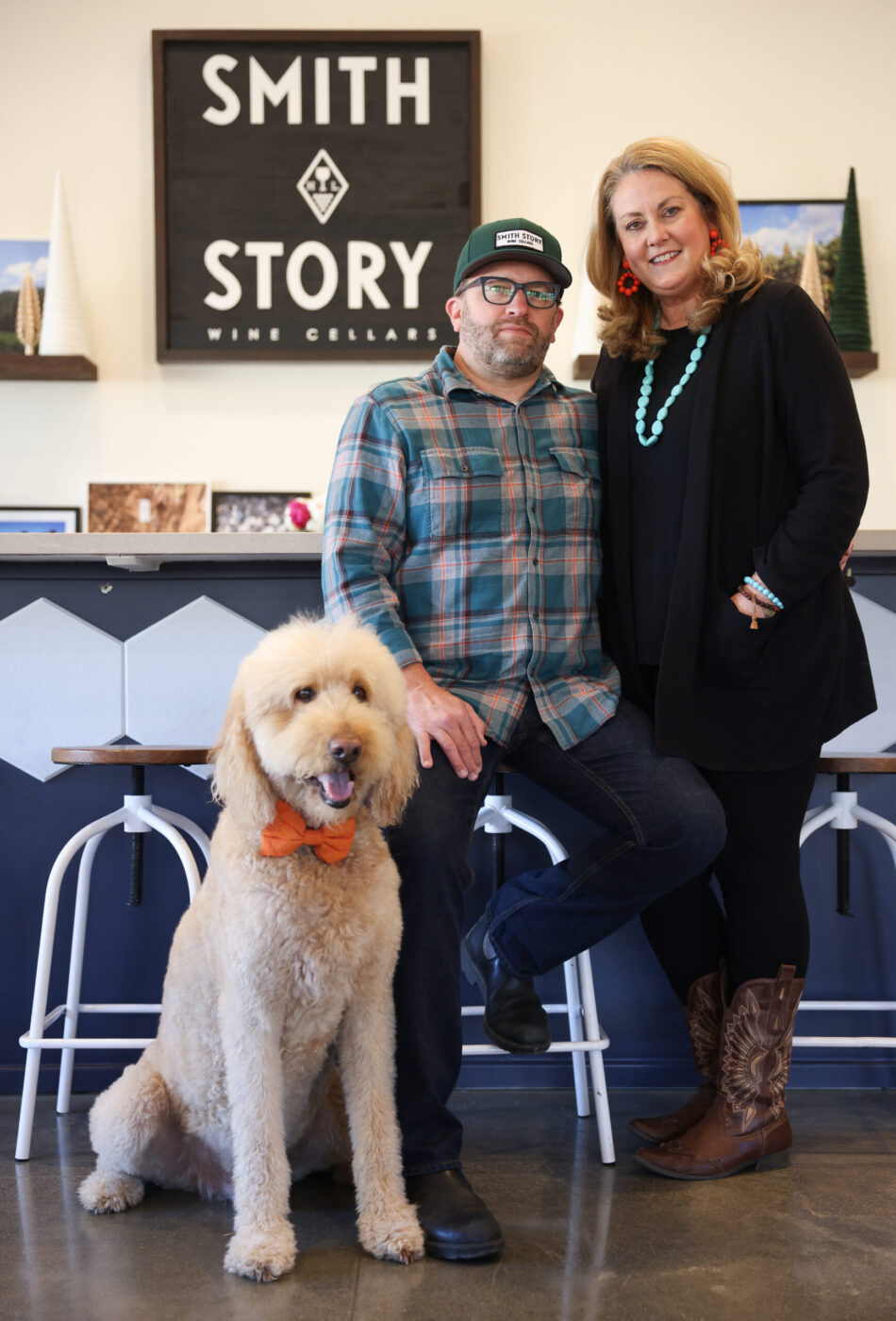 Eric Story and Alison Smith Story, with their dog Lord Sandwich, at their Smith Story Wine Cellars location in Healdsburg on Monday, Dec. 11, 2023. (Christopher Chung/The Press Democrat)