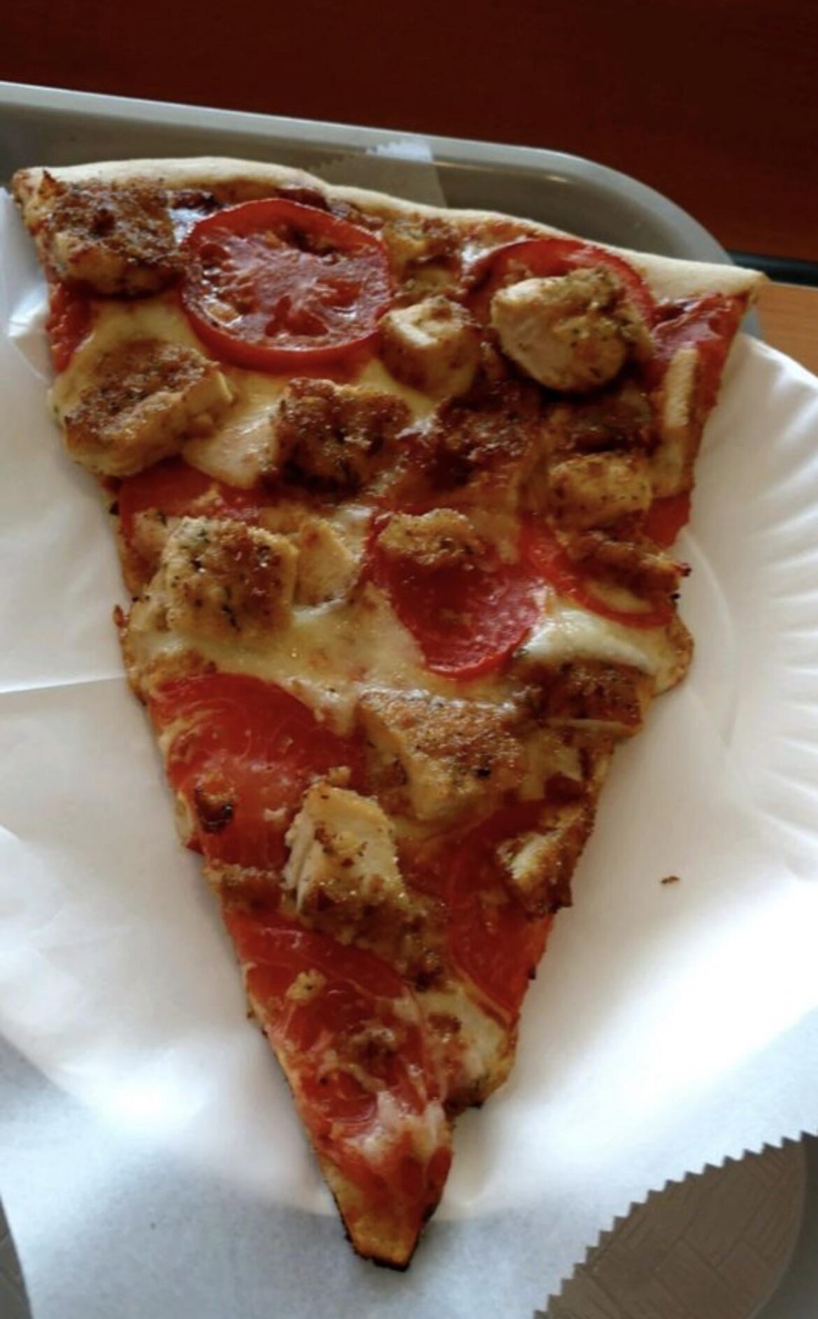 Chicken cutlet with fresh tomato slices