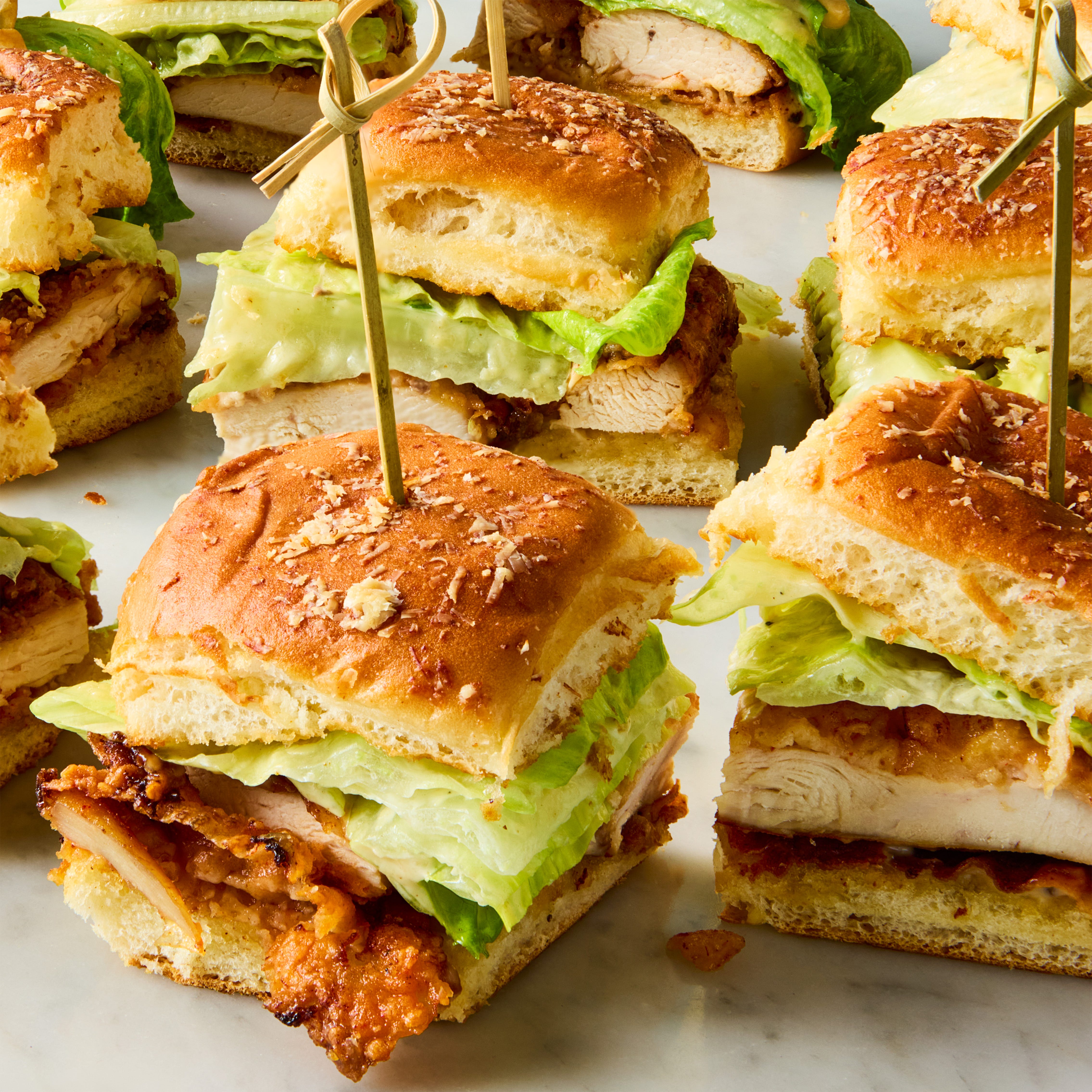 sliders with chicken, lettuce, and caesar dressing