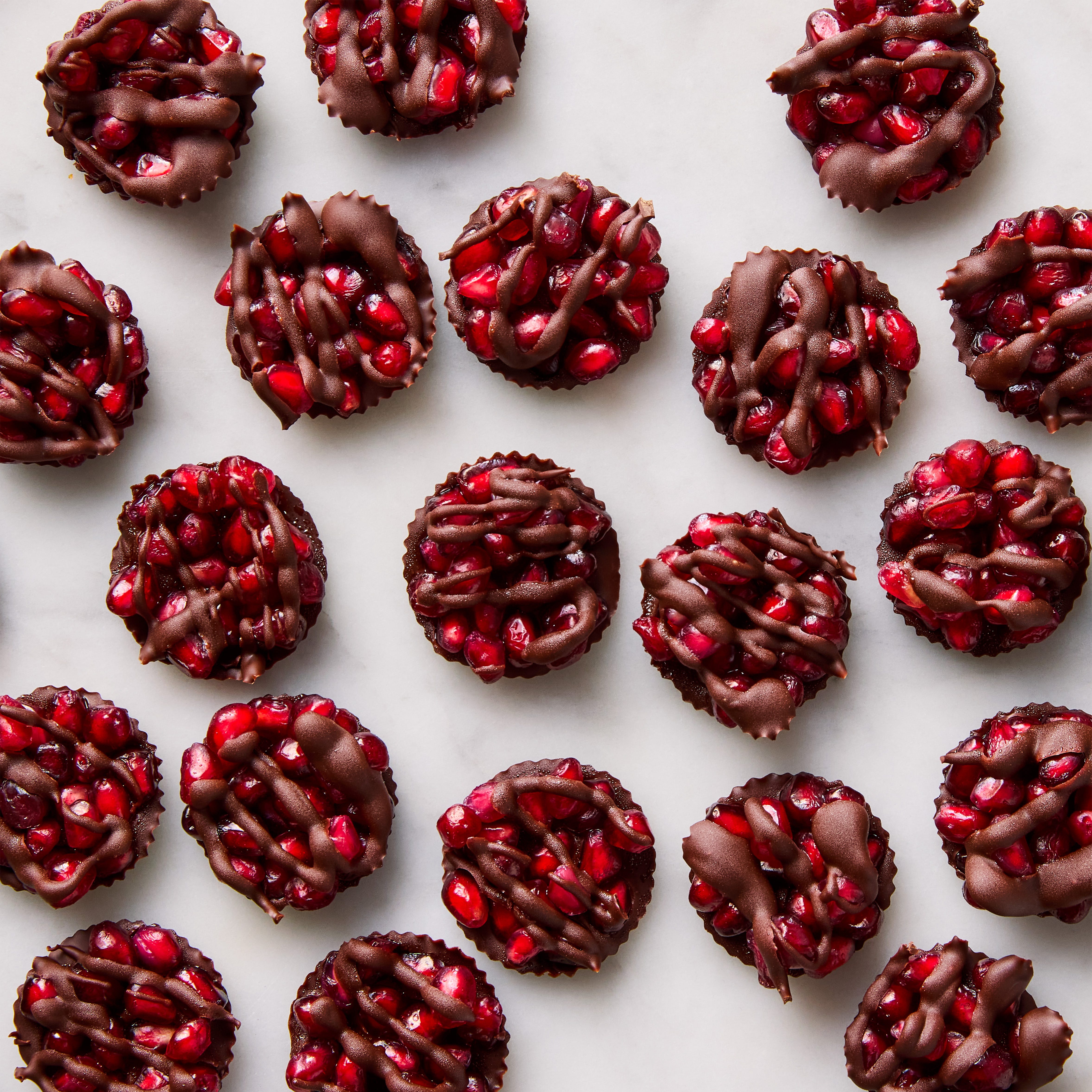 chocolate discs filled with pomegranate seeds