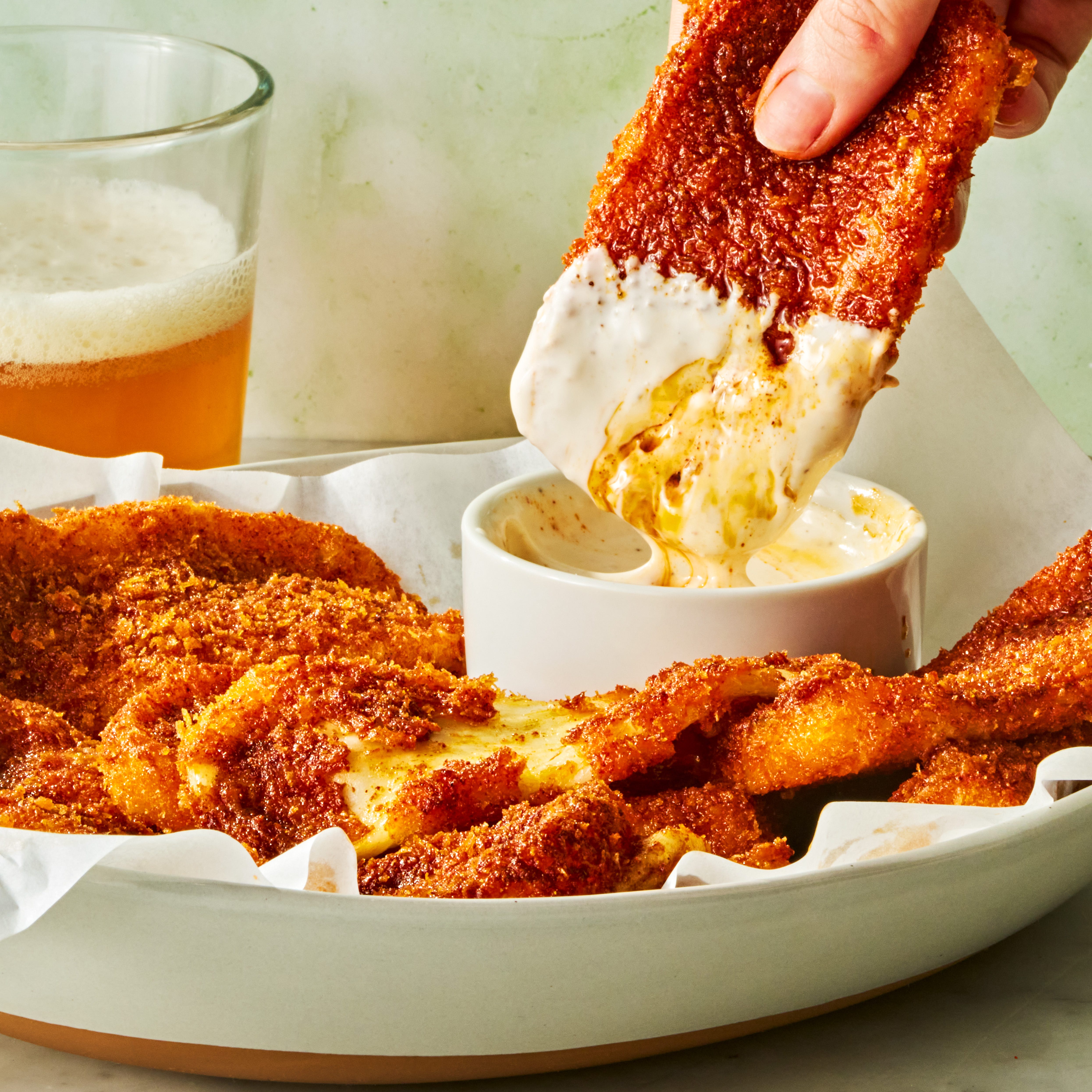 mozzarella sticks covered in hot sauce