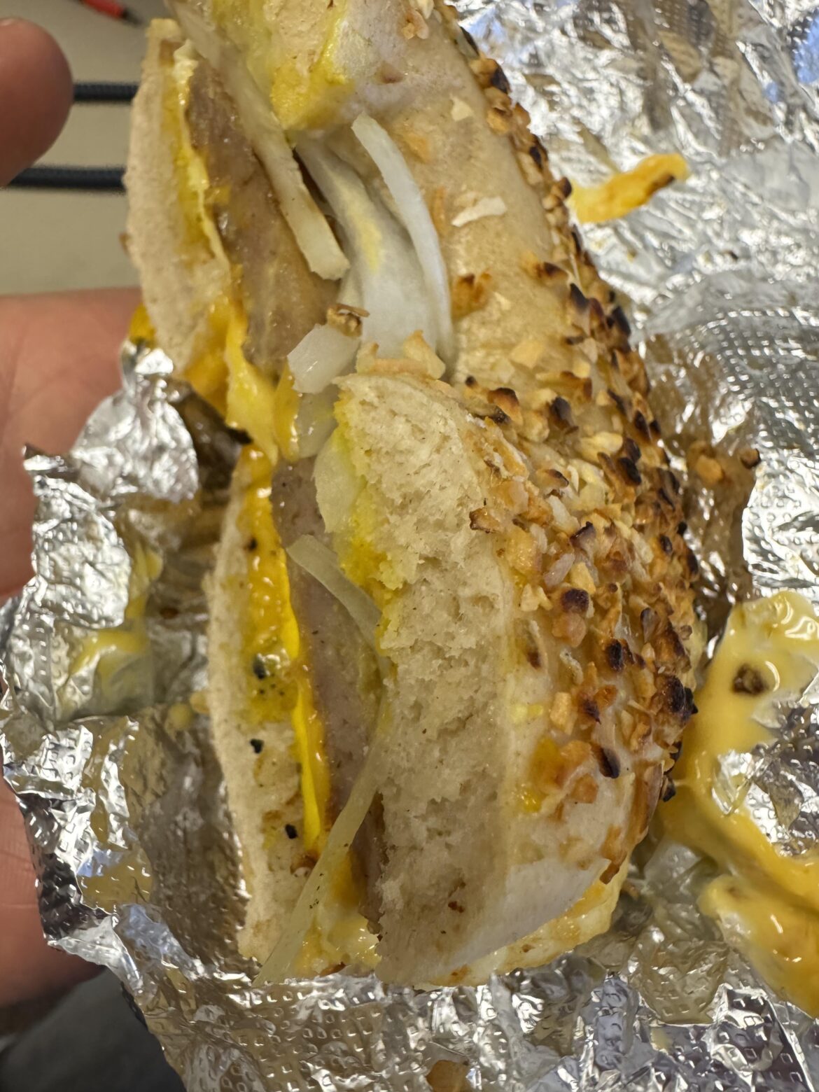 Raw onion on onion bagel breakfast sandwich