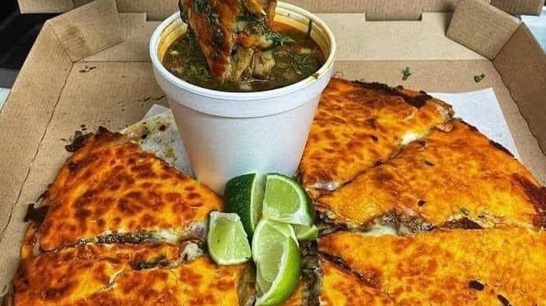 The barria pizza at Birrieria La Cabaña in a cardboard pizza box