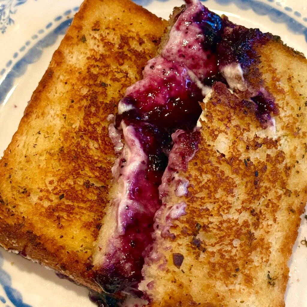 Goat cheese-blueberry preserves-herb butter grilled cheese for breakfast Woow!!