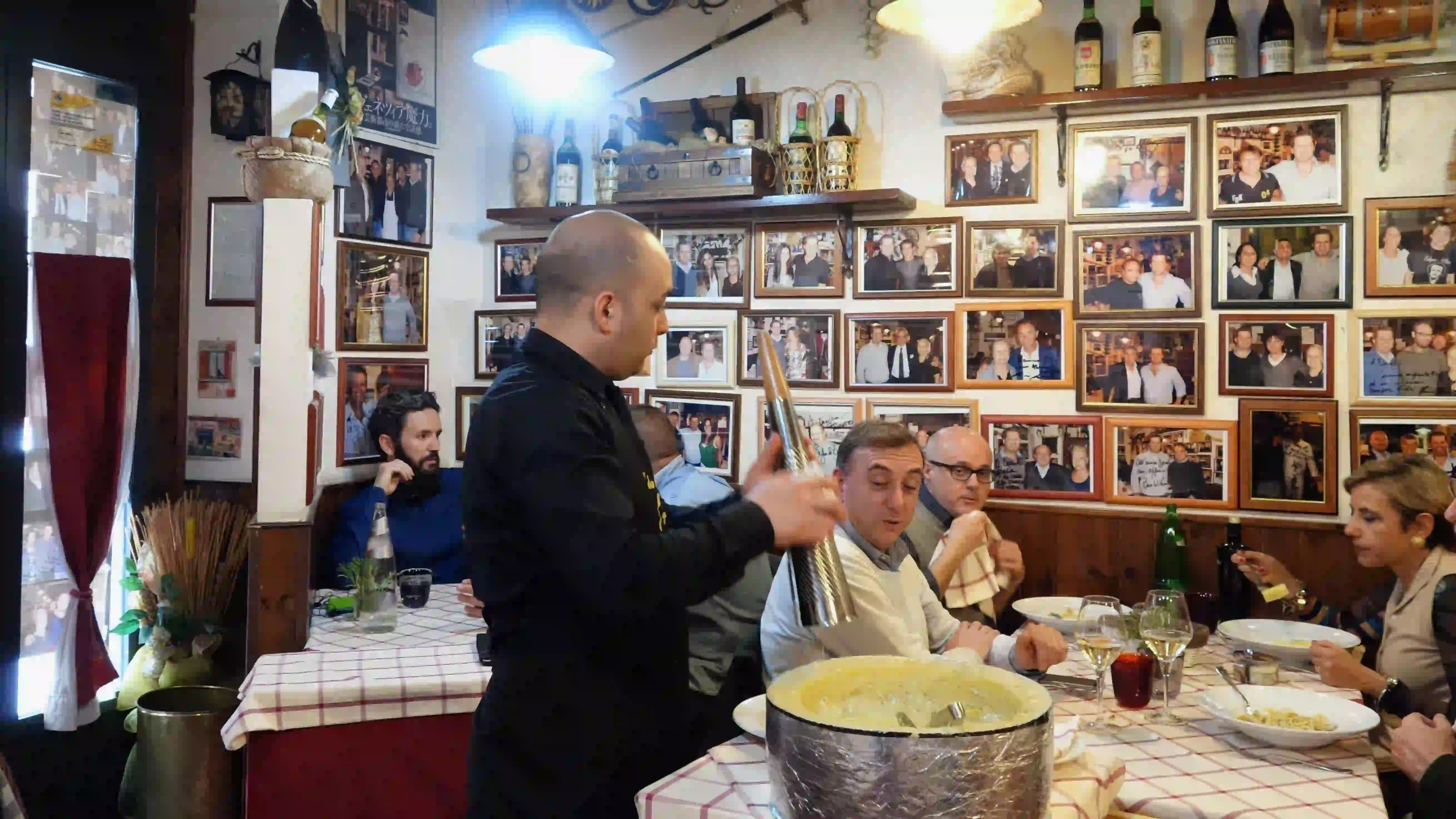 da danilo - preparing cacio e pepe in a cheese wheel