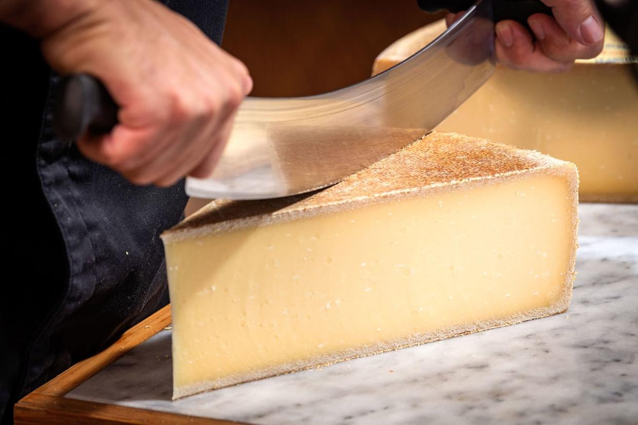 Traditional fondue calls for a 50/50 split of Gruyère (pictured) and Emmentaler, but some chefs use a 60/40 or two-to-one ratio. ventdusud / Getty Images