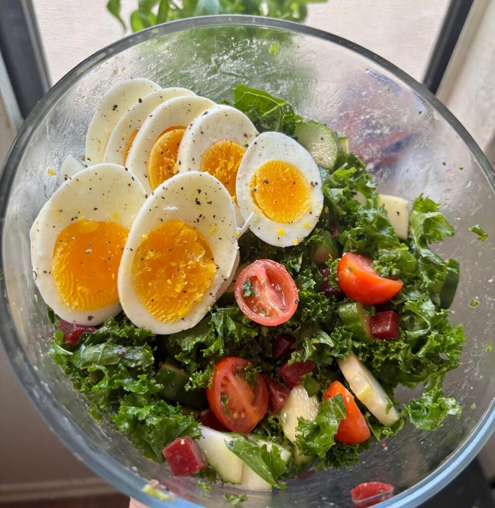 Been feeling very unhealthy lately, so I made a huge salad. No dressing, but I spritzed olive oil on the kale to massage it, topped it with black garlic salt.