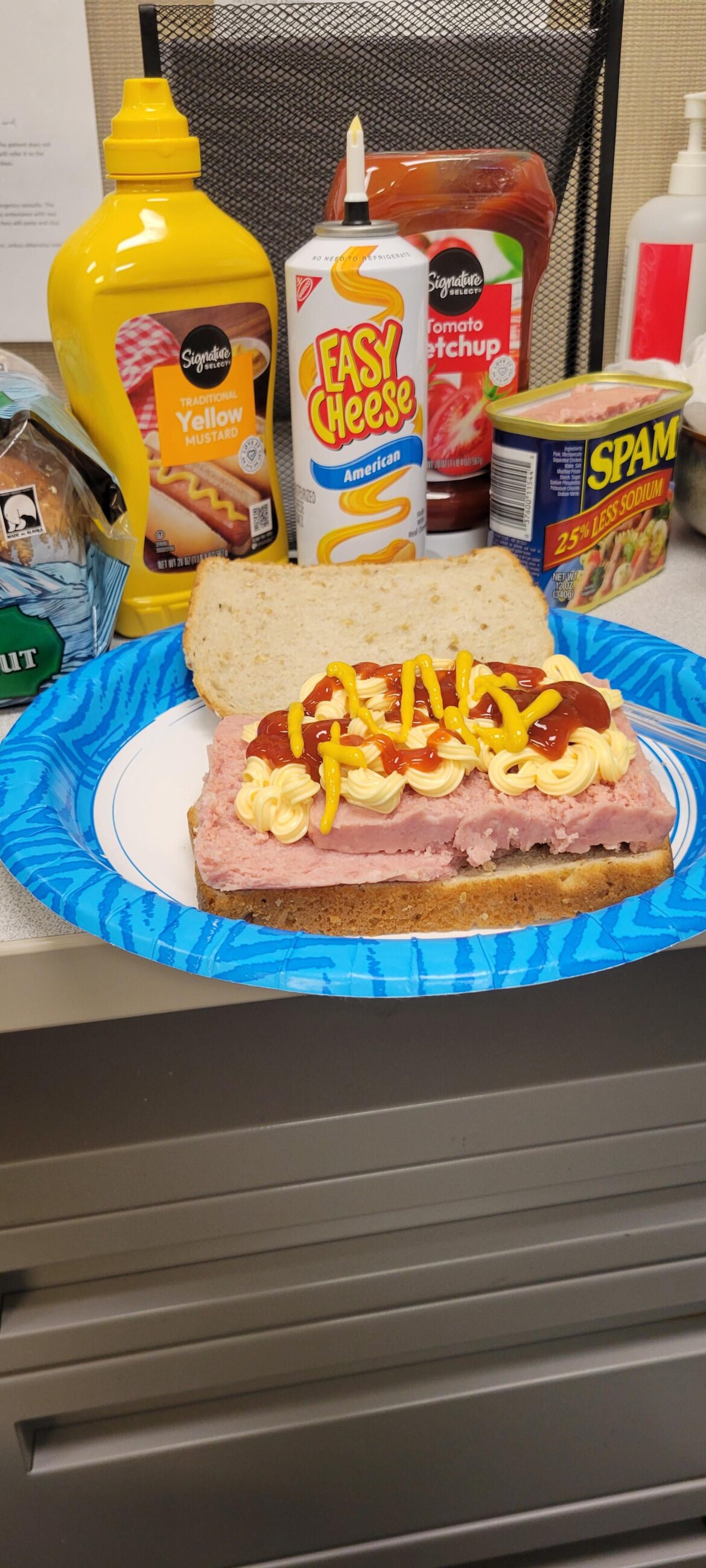 Spam sandwich with easy cheese, mustard and ketchup