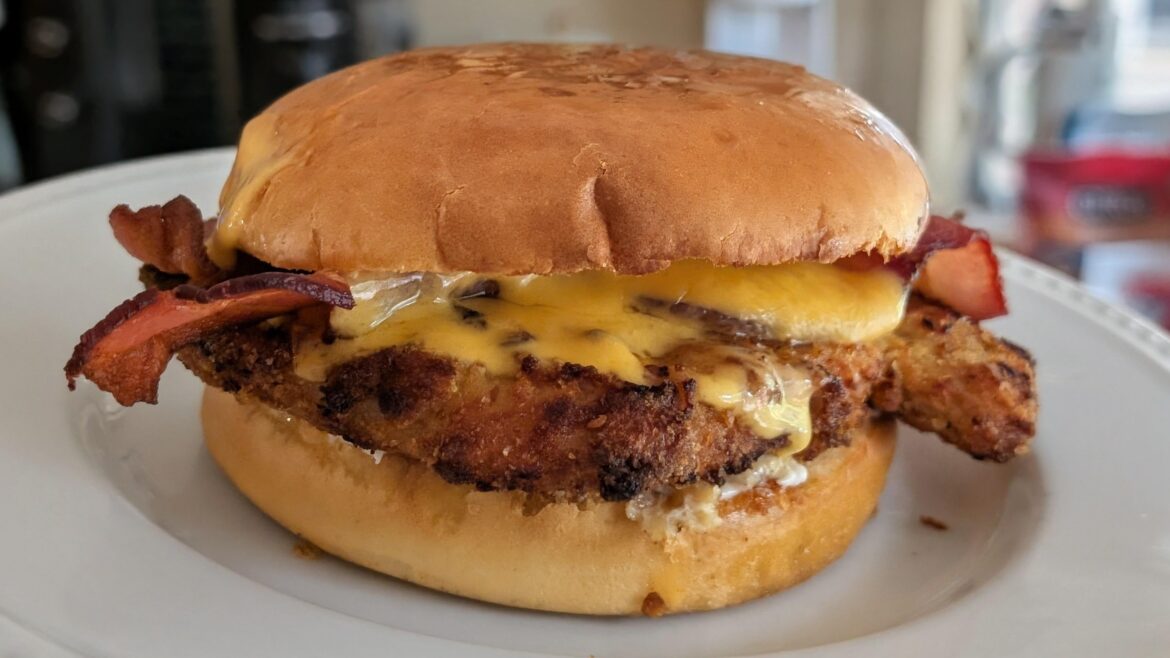 Pork schnitzel and bacon sandwich