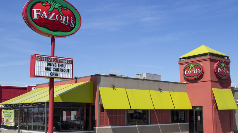 a Fazoli's restaurant with next to tall roadside sign