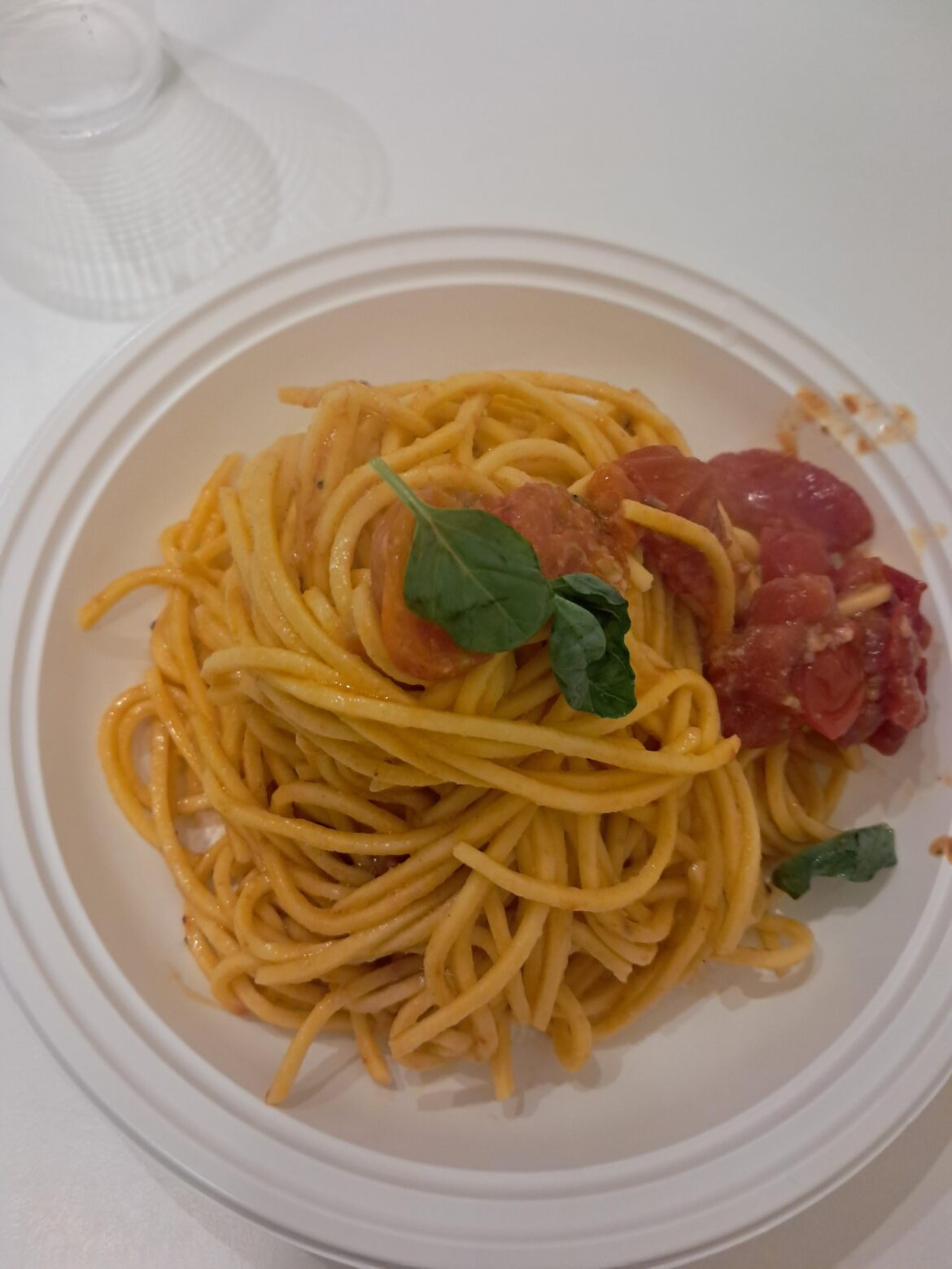 Pasta with garlic, oil, cherry tomatoes, and basil.