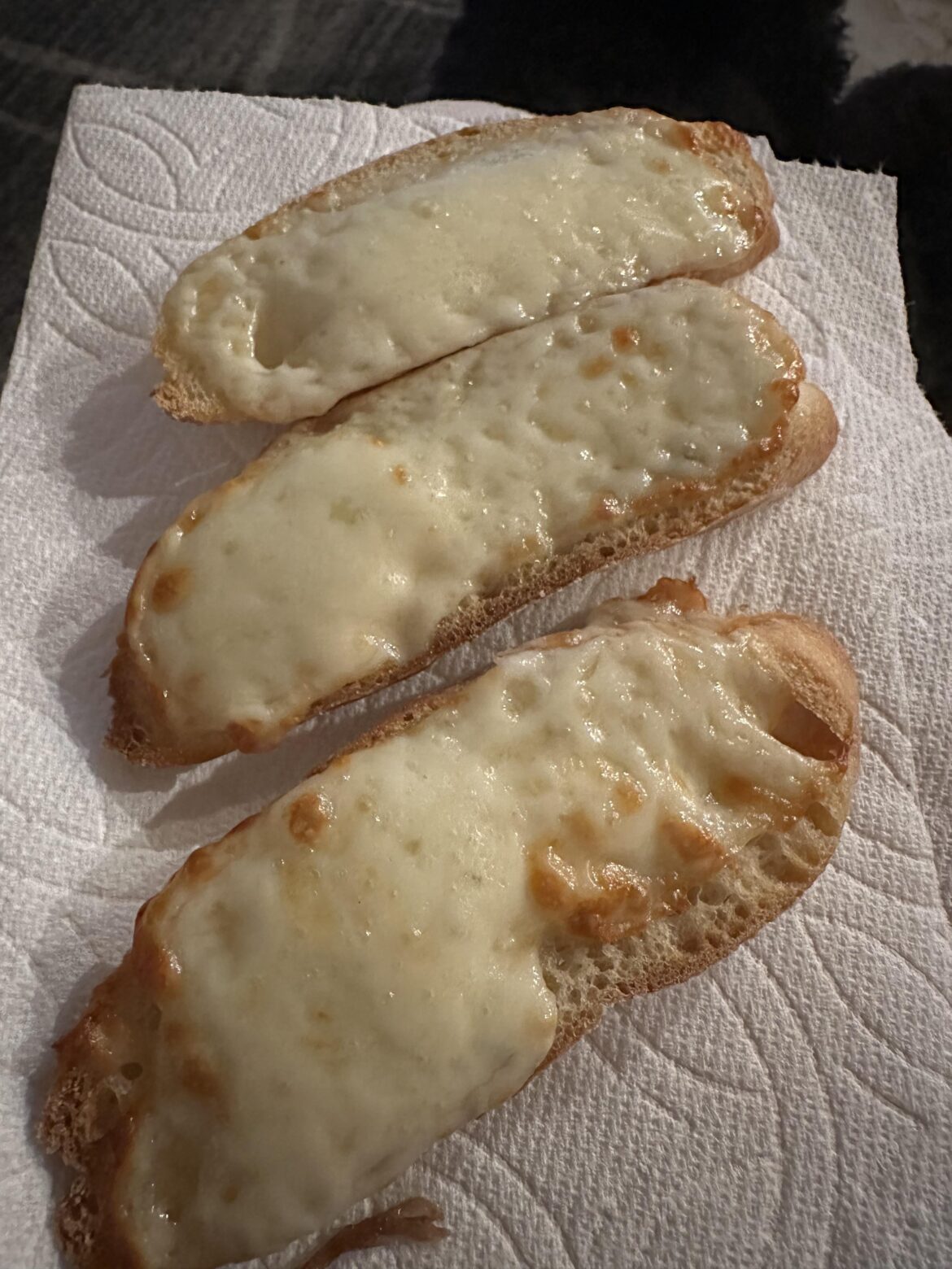 Toasted cheese toast that I cooked in air fryer and served on a paper towel as I finished off my jug of wine.