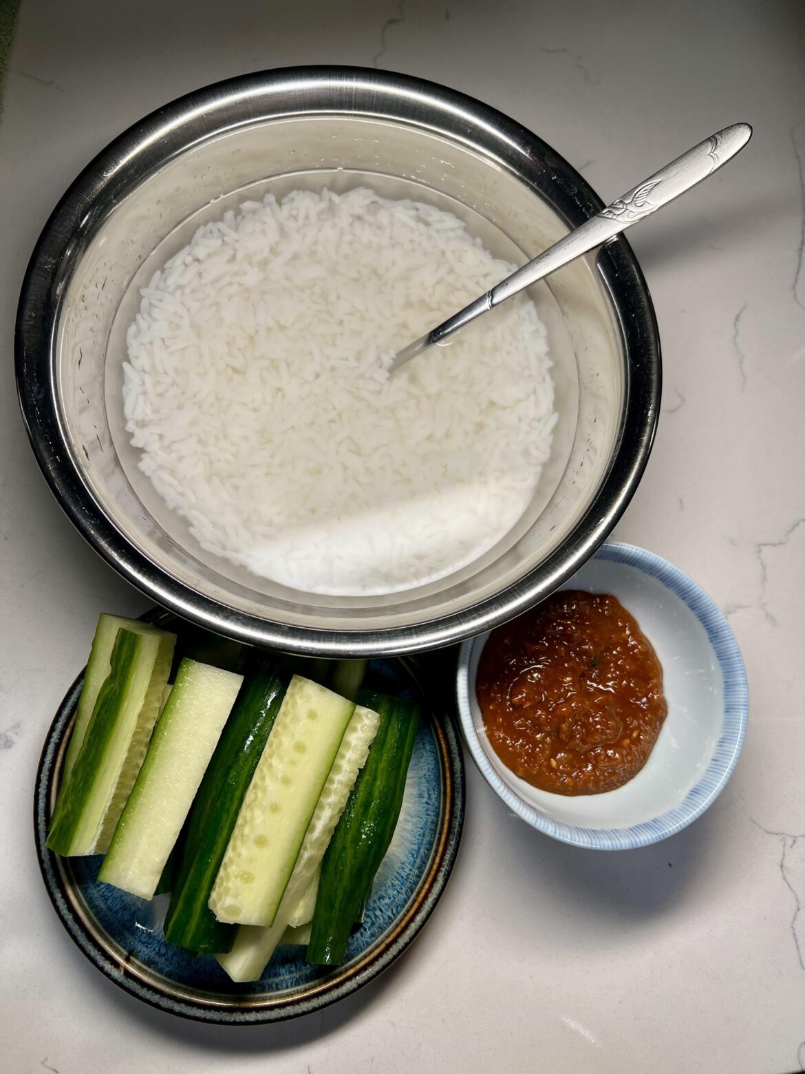 Ice cold water on piping hot rice