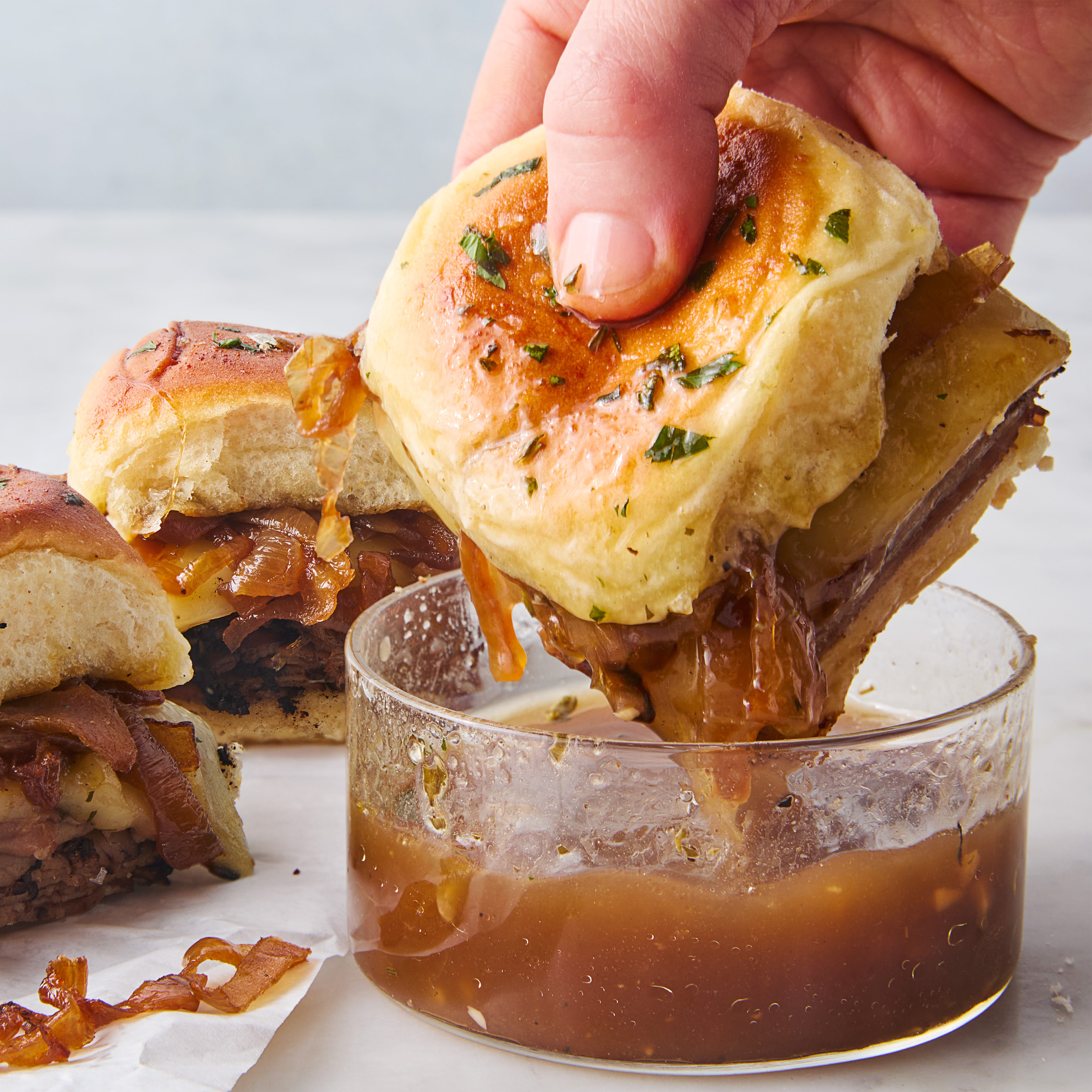french dip sliders on rolls with au jus