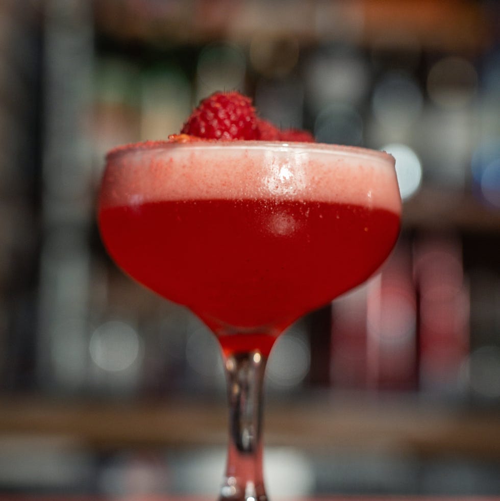 cocktail with raspberry on top