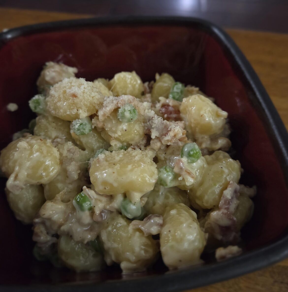 Gnocchi with peas, bacon, and cream