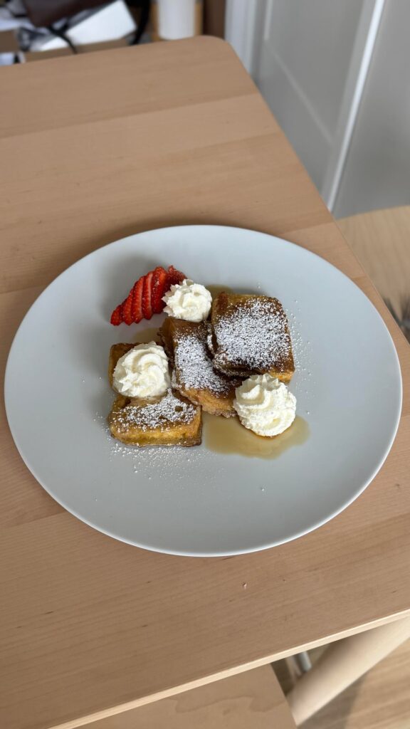 French toast with isi whip cream, strawberry, local maple syrup