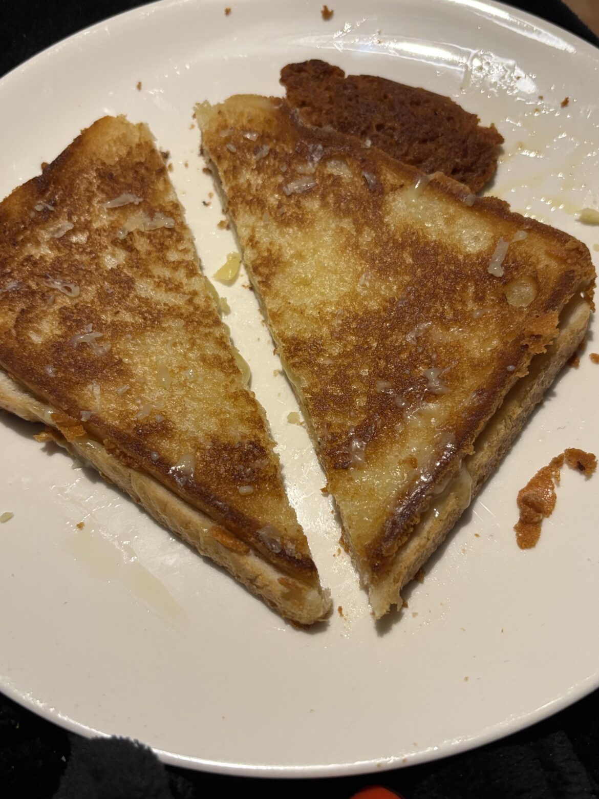 Grilled cheese with some fried cheese on the side. 🧀