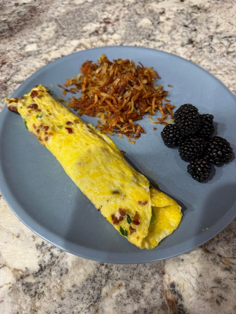 Breakfast for dinner - bacon, Swiss scallion omelet with hashbrowns for wife, double BEC on onion roll with side salad for me. Kids had leftovers haha
