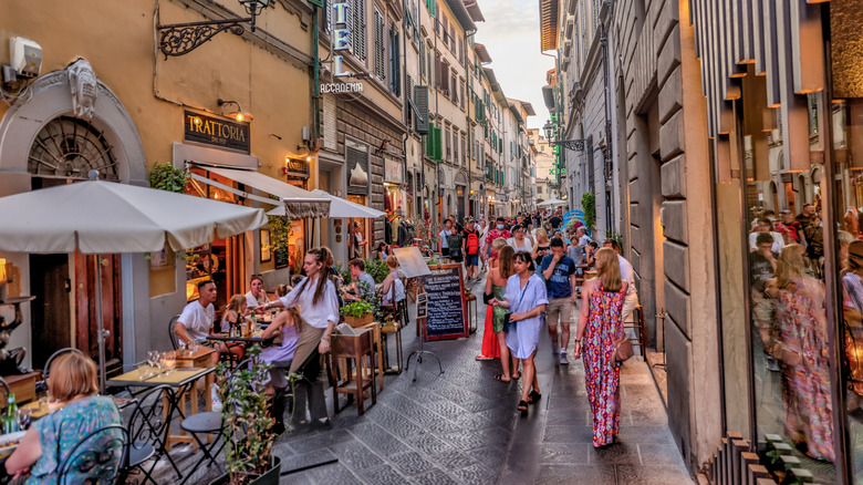 People shopping and dining on the streets of Florence