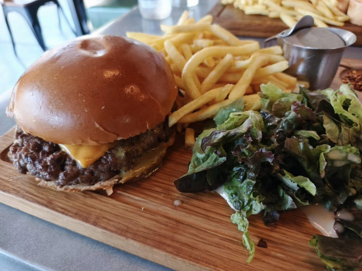 one nice, juicy burger with a side salad and fries, their signature swiss butter sauce is so good also.