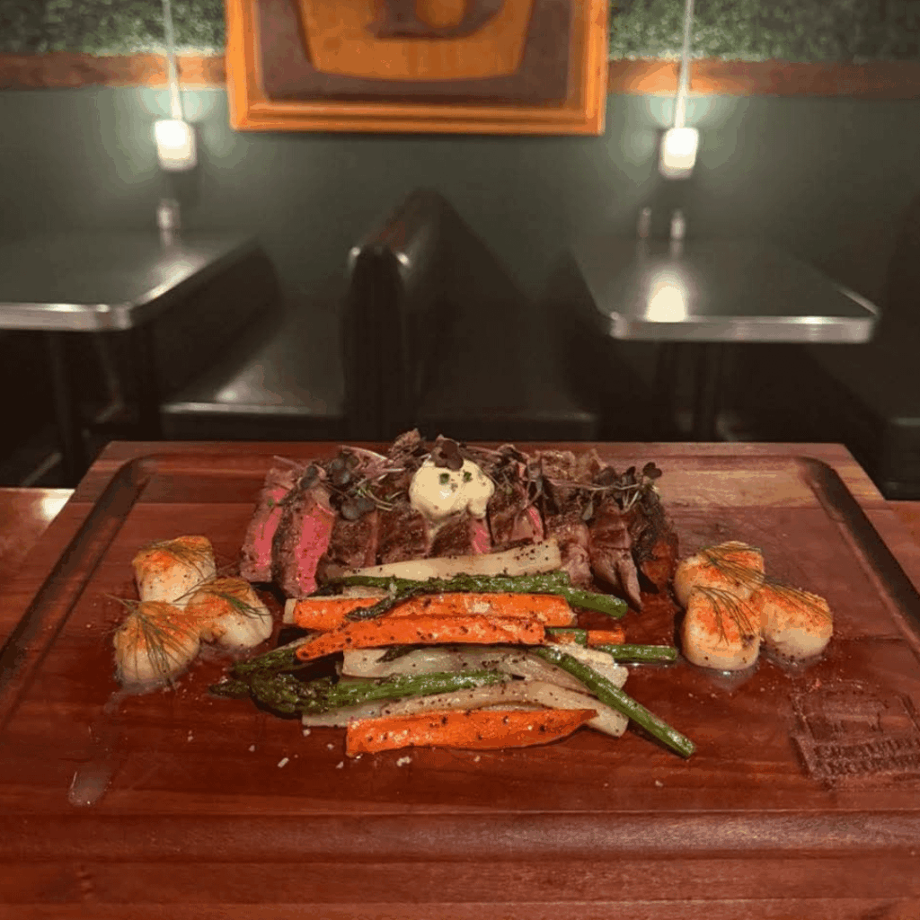 Valentine’s dinner for two 🪵 12 oz Ribeye with Bone Marrow Butter, Scallops topped with Roma Tomato Dust, and Roasted Carrots, Parsnip, and Asparagus.