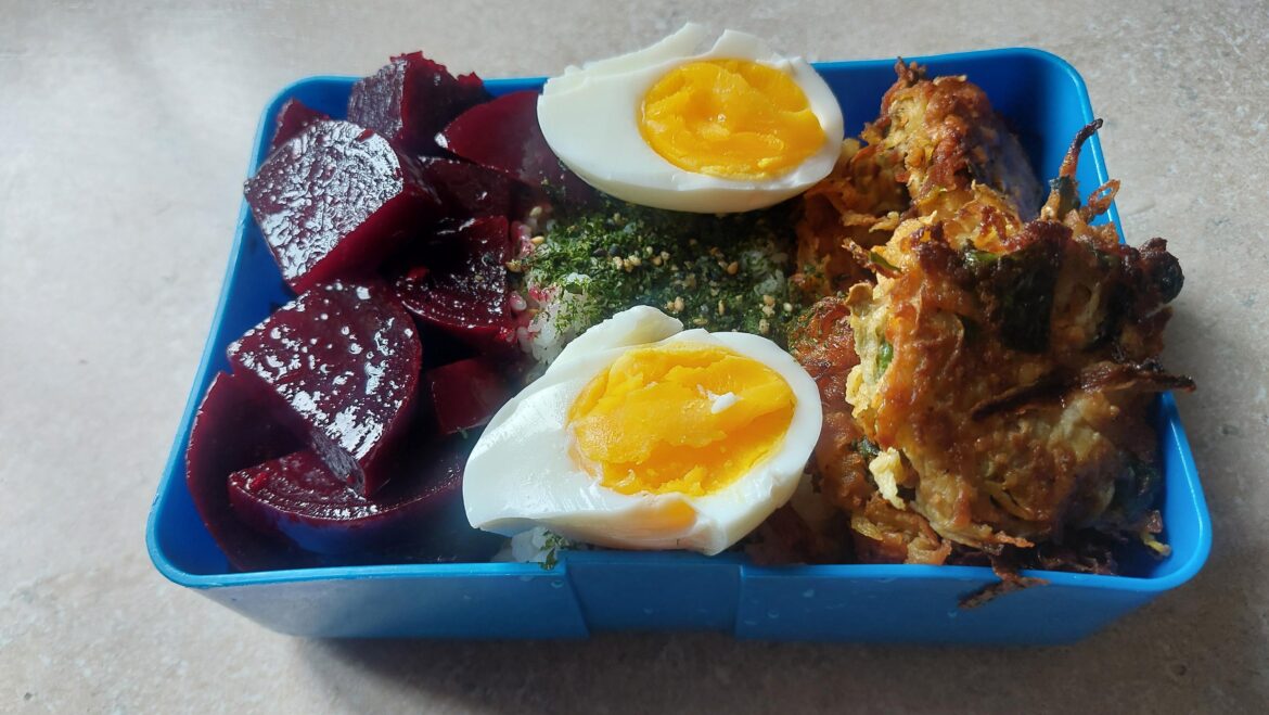 Packed full bento - Beet Poke, turnip fritters, rice with furikake and an egg.