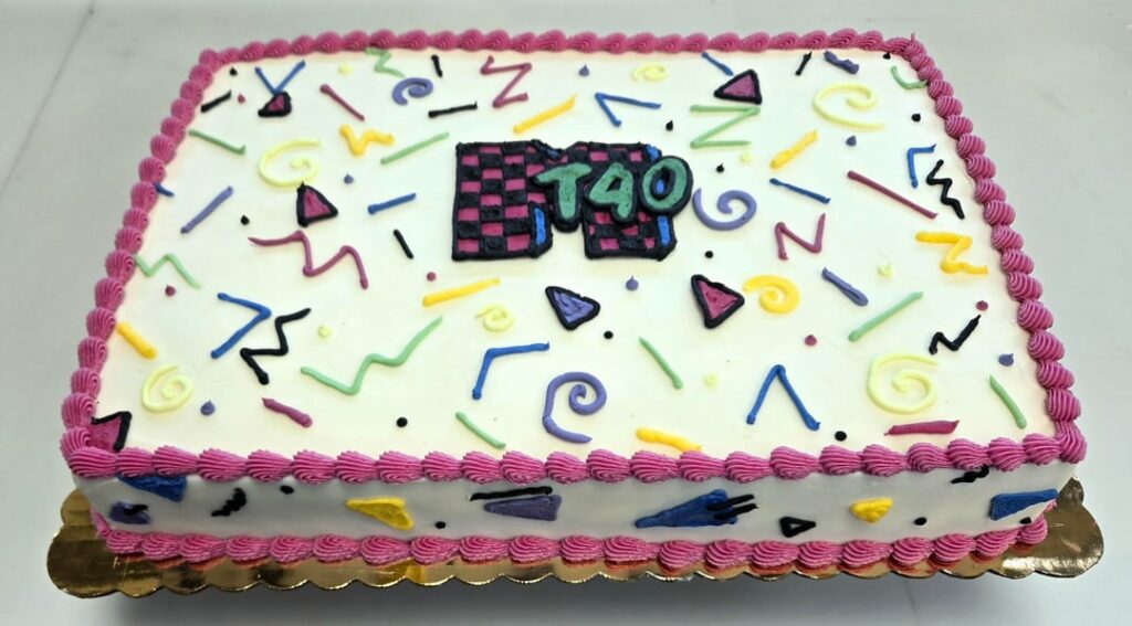 '90s theme half sheet and some floral cupcakes