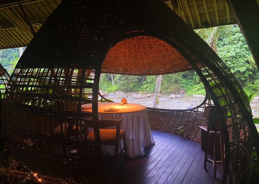 The teak wood pod at Kubu at Mandapa Ritz Carlton hotel - a fine dining restaurant in Ubud Bali, with romantic ambiance