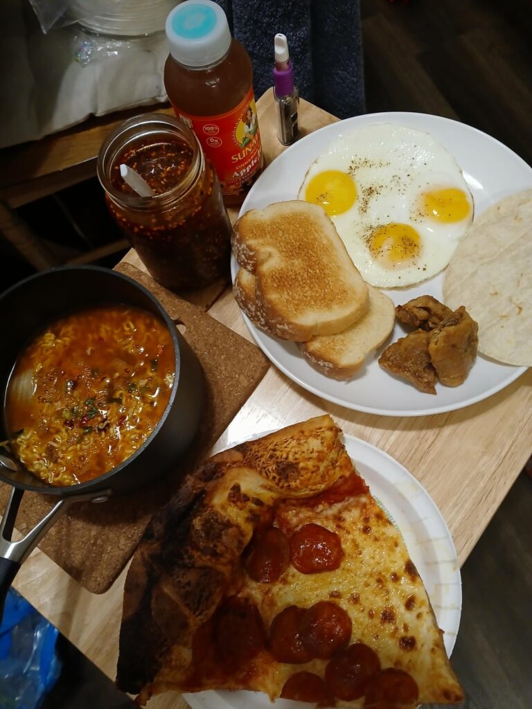 Can't pick what to eat... shin ramyun, costco pizza, sunnyside up eggs, toast, chicharrón, tortilla, salsa macha, and Sun-Maid x Arizona