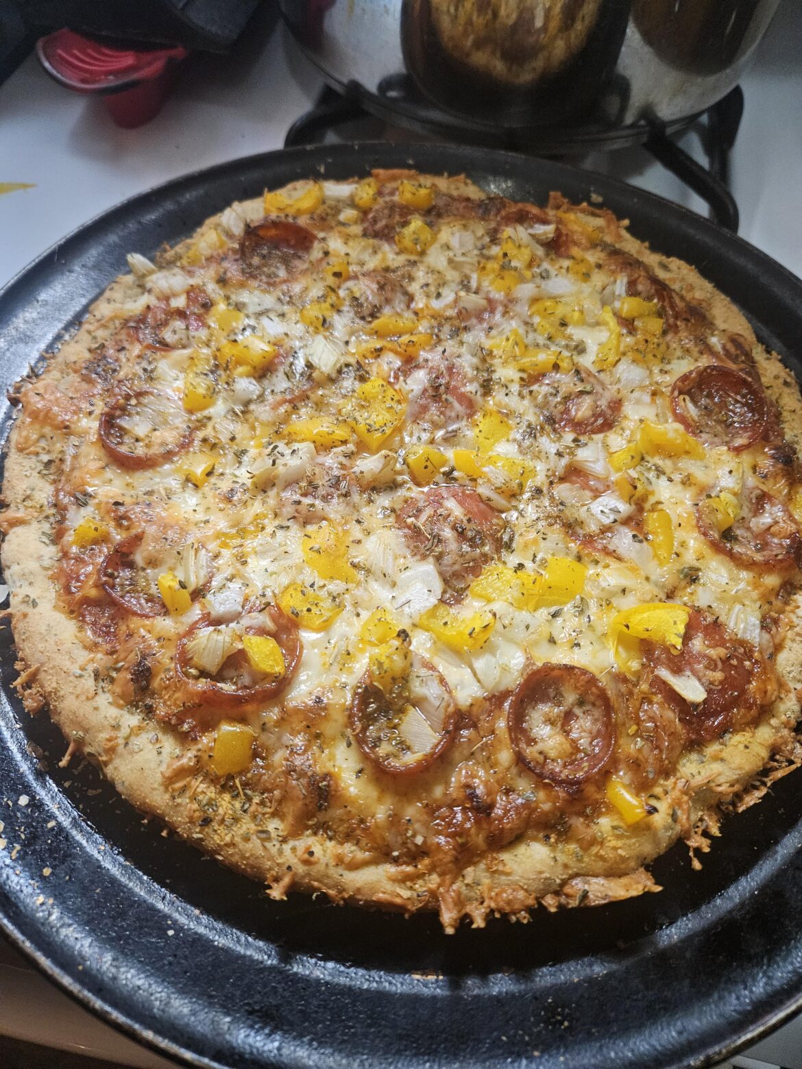 Herb crusted with pepperoni, onion & sweet bell peppers. 🤌