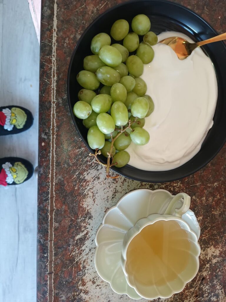 Yogurt, grapes and tea (and my Grinch slippers: not edible!! lol)