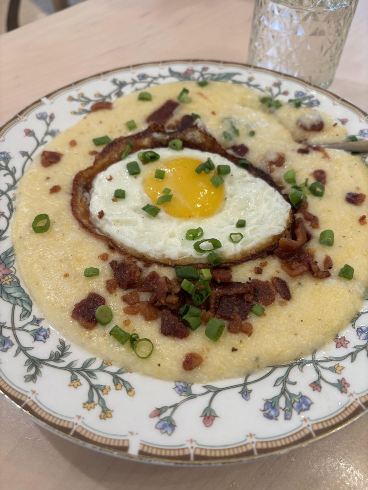 [I ate] Cheesy Grits with bacon and sunny egg because not every New Jersey breakfast includes pork roll
