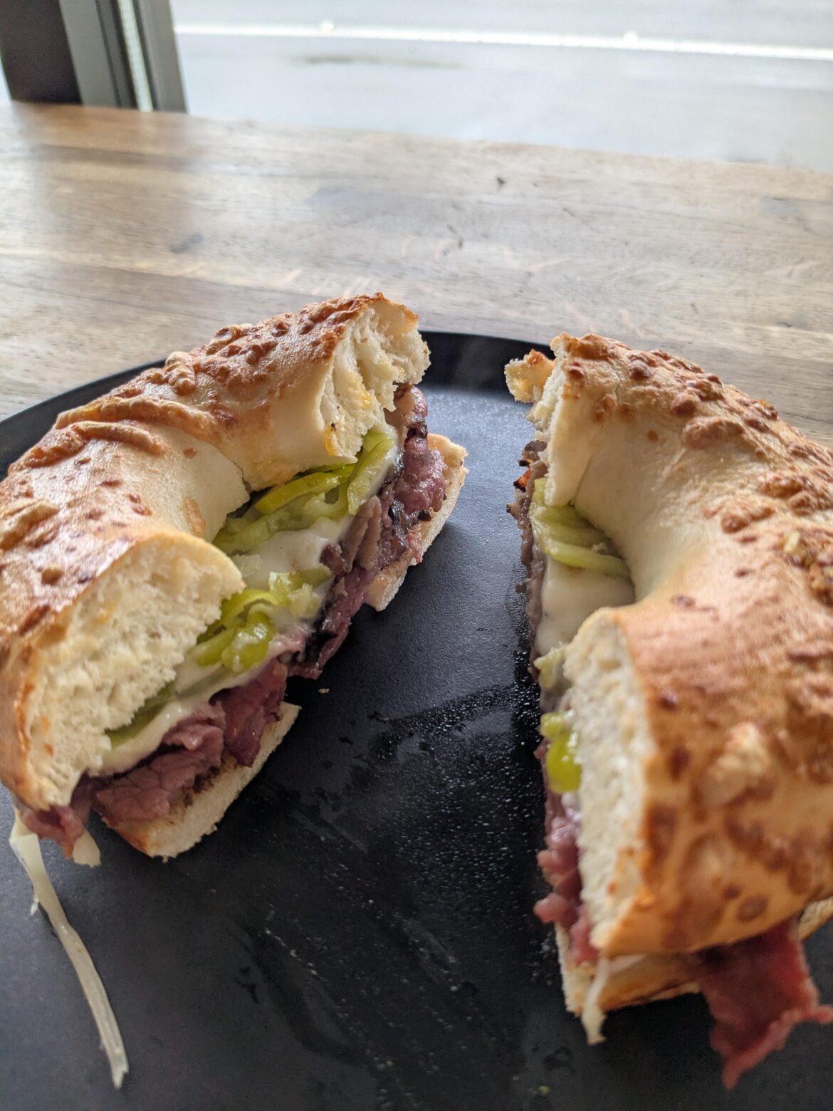 Roast beef & pastrami on an asiago bagel.