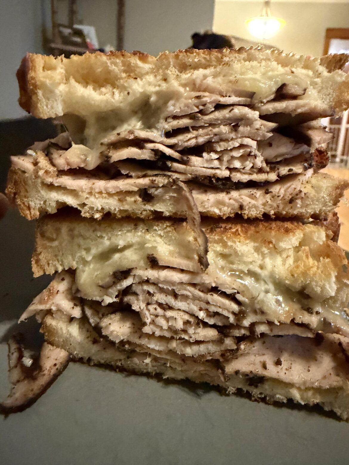 Pastrami seasoned turkey, caramelized onion jack cheese, dijon mustard, horseradish mayo, on griddled Italian bread.