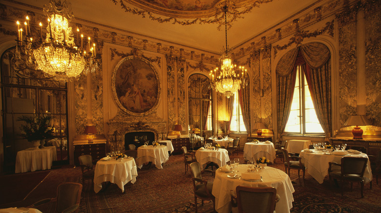 Interior of an elegant, fine dining restaurant with white tablecloths