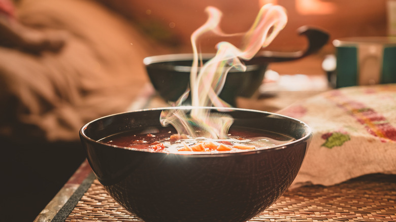 bowl of hot soup with steam
