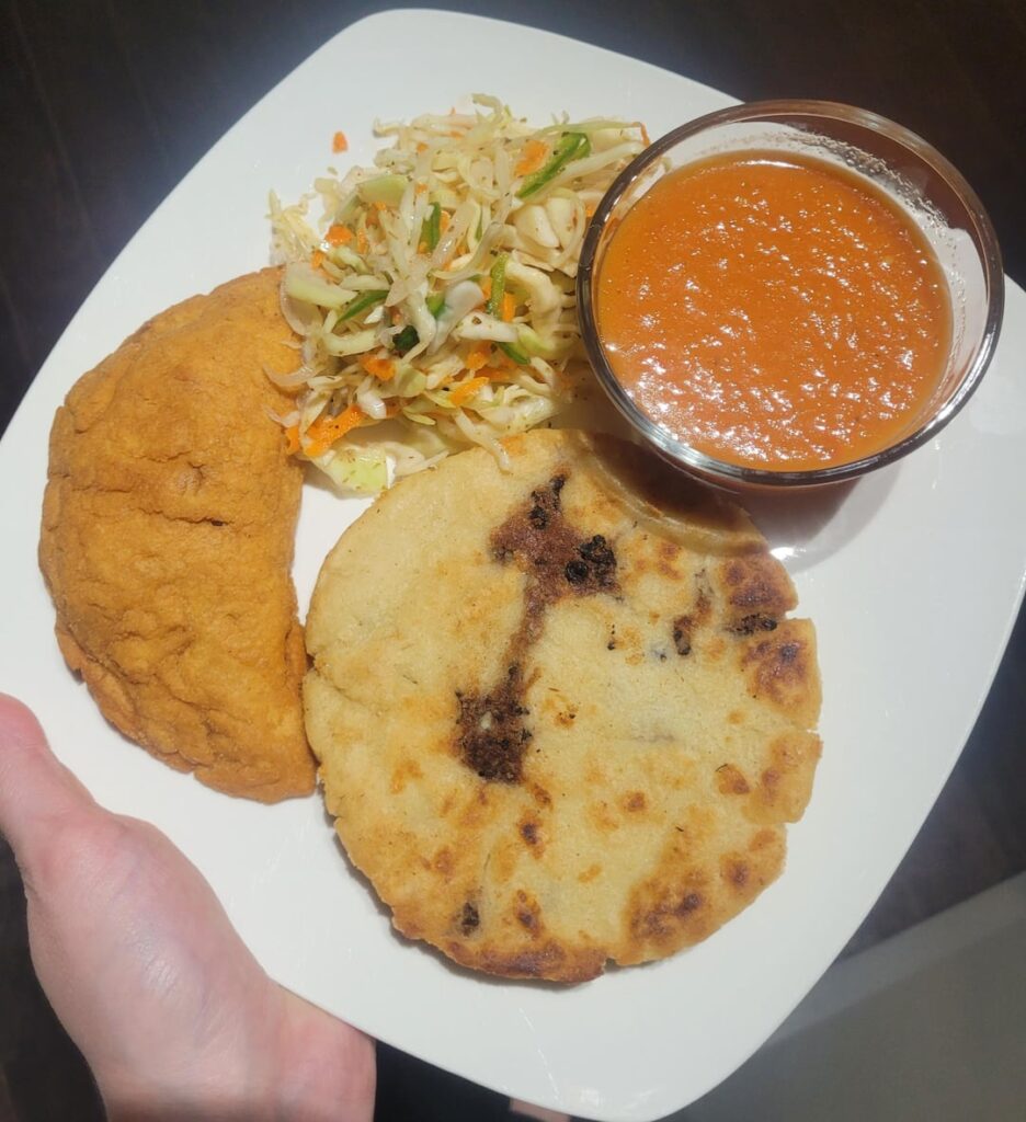 Homemade papusas, pastelitos, curtido and salsa