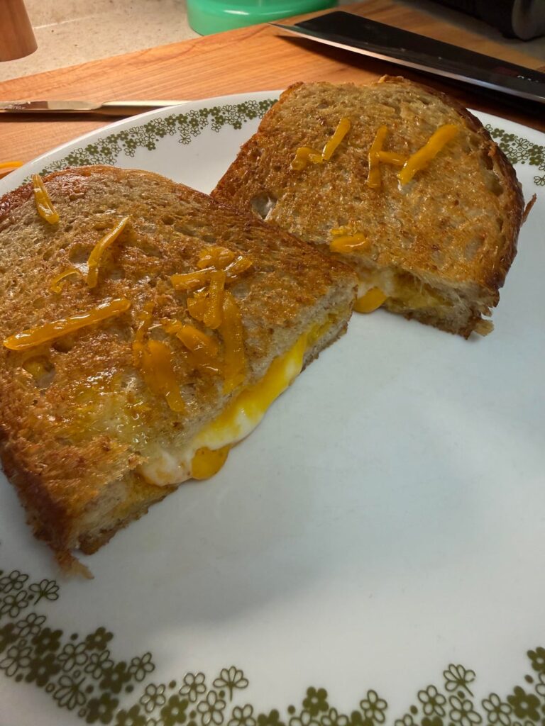 Trader Joe’s sourdough, layered moz and cheddar