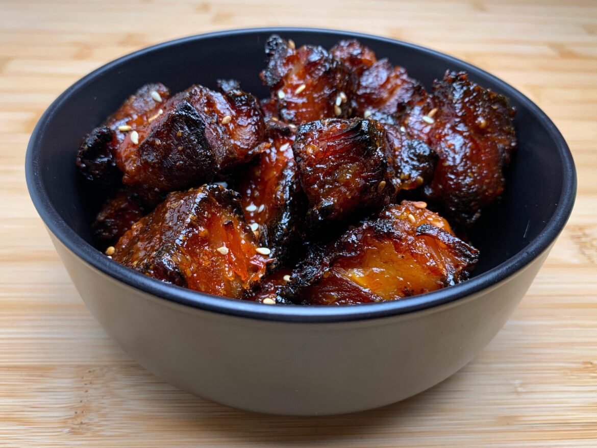 Pork shoulder burnt ends in a little black bowl