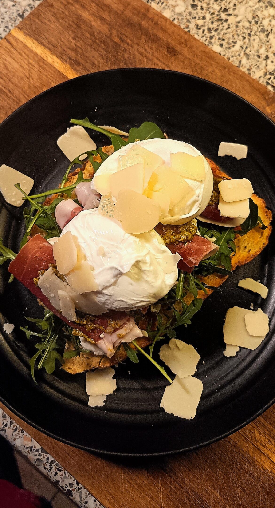Homemade food - poached egg on a Serrano ham, chorizo jam and wholegrain sourdough.