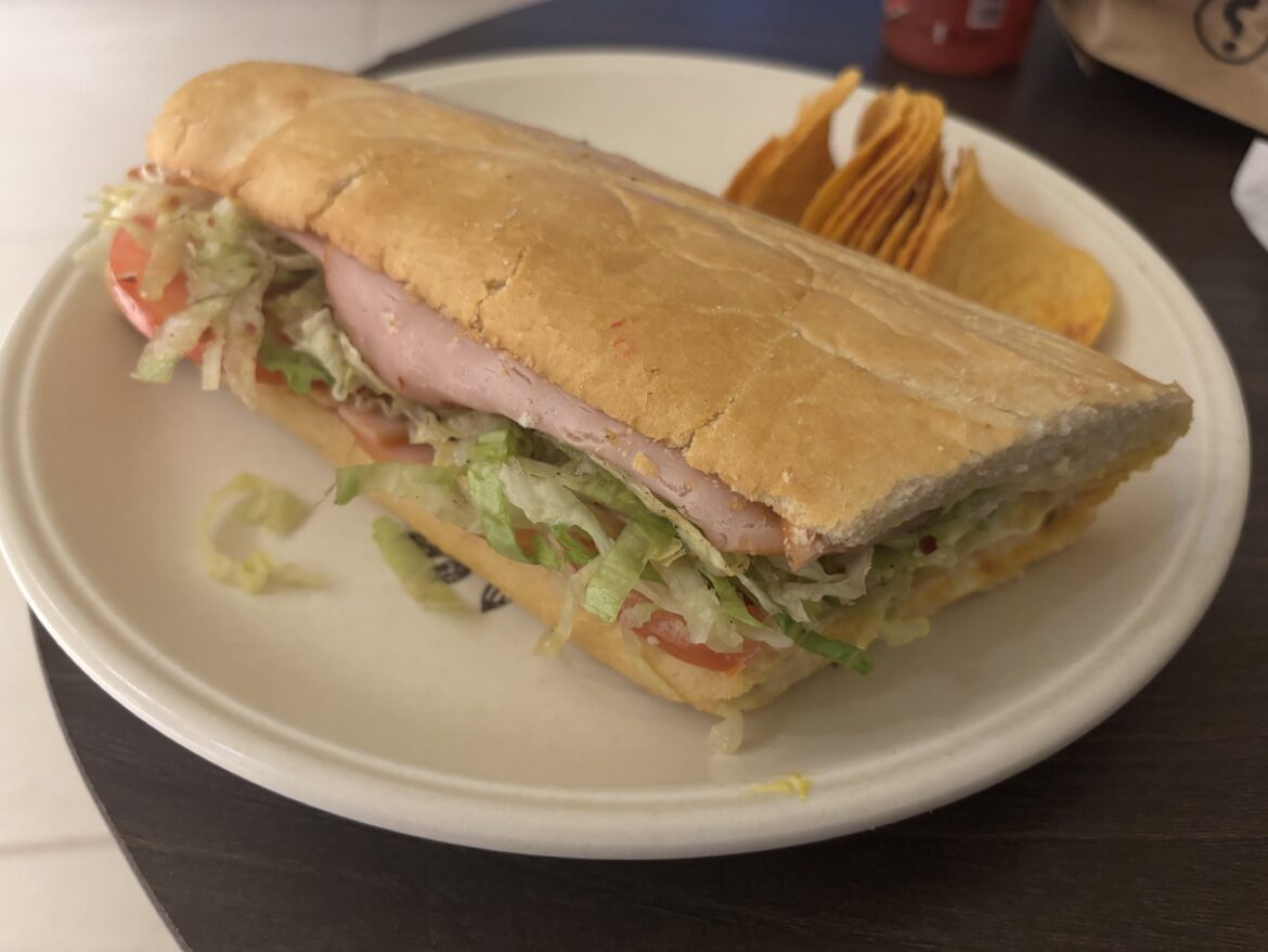 Turkey thigh, lettuce, tomato, caramelized onions, jalapeños, swiss and american cheese, mustard and mayo. And hot & spicy pringles.