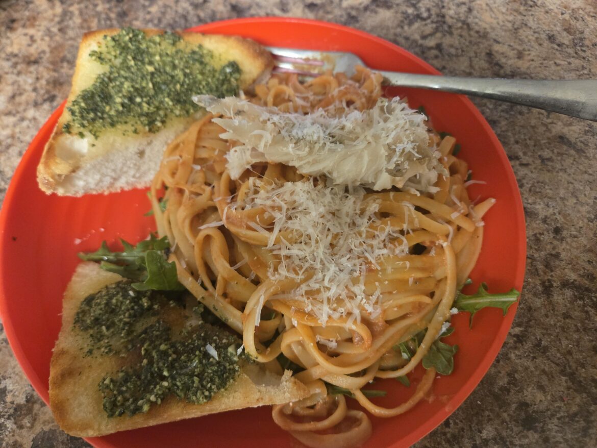Garlic Butter Lobster Tail Linguine with Creamy Tomato Sauce, Pesto Crostini and Arugula Salad