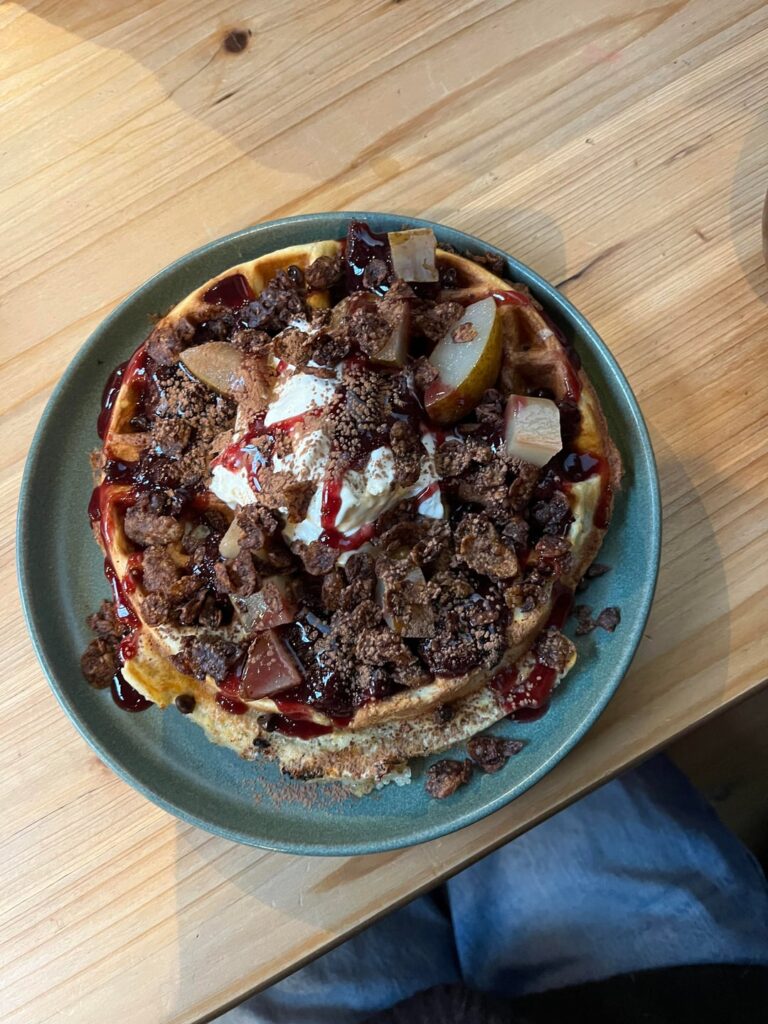 Belgian waffle with berry compote, cream, cherry sauce, poached pear and chocolate cornflakes- 950 seems fair??