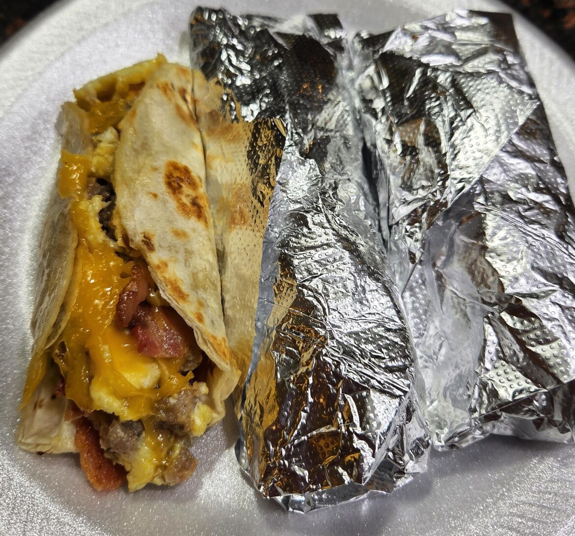 Breakfast tacos with sausage and bacon.