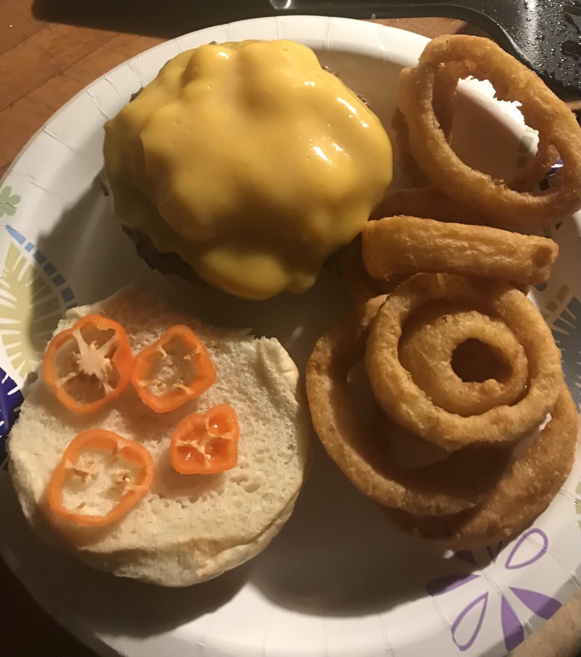 Cheeseburger with habanero peppers and side of onion rings