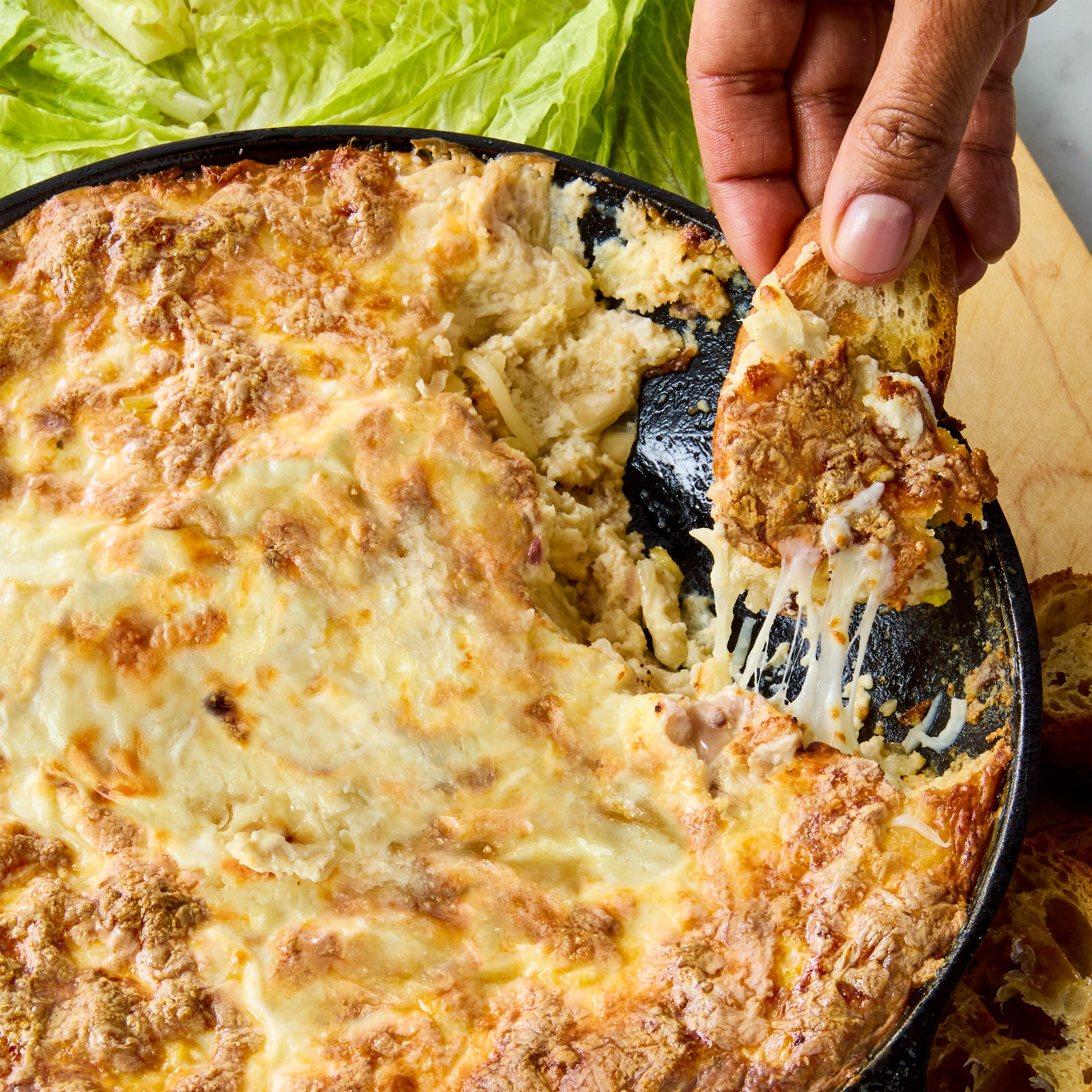 creamy baked dip with veggies and bread