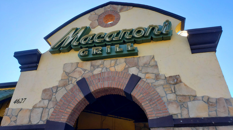 restaurant entrance to Macaroni Grill with decorative stone and brick on the facade